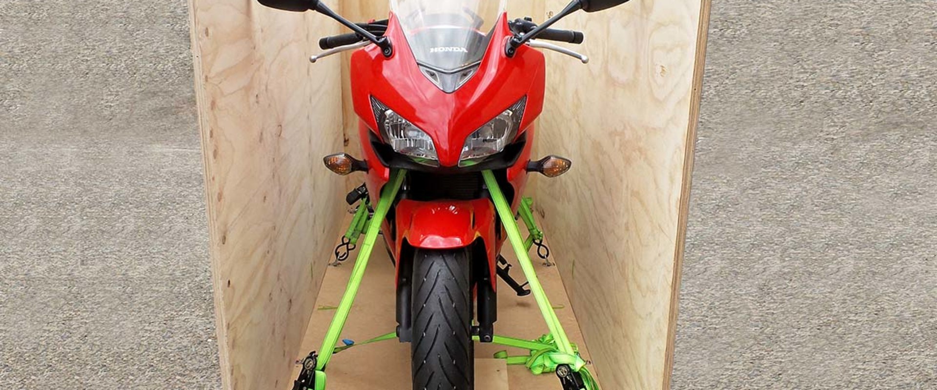 How do you pack a motorcycle in a shipping container?